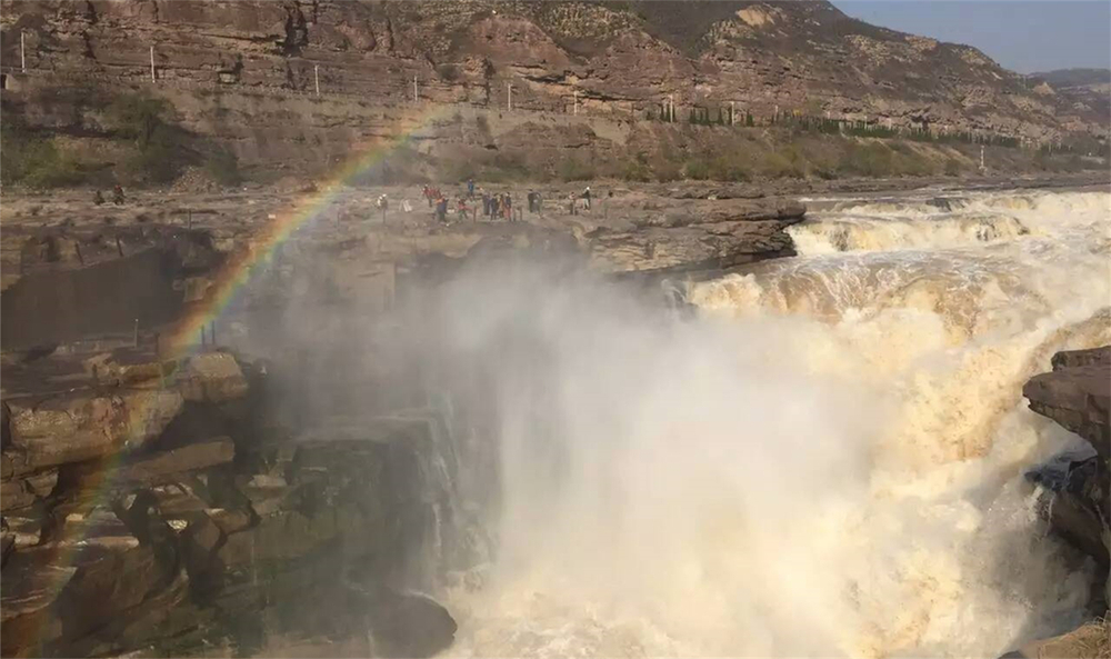 The rainbow just above the Yellow River Hukou Waterfall